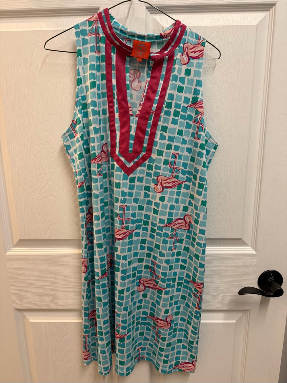 sleeveless resort-style shift dress by Tracy Negoshian is designed warm-weather